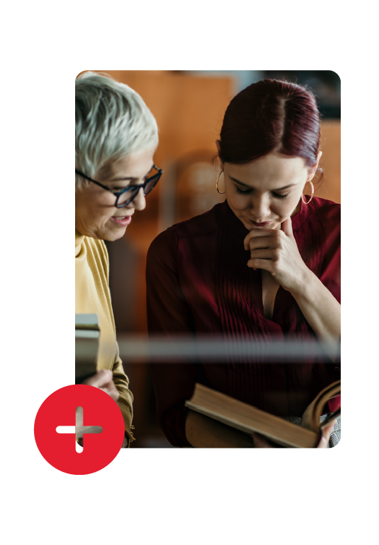 two women reading a book