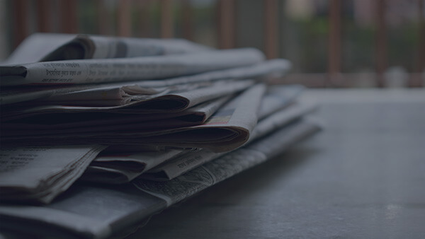 pile of classified newspapers